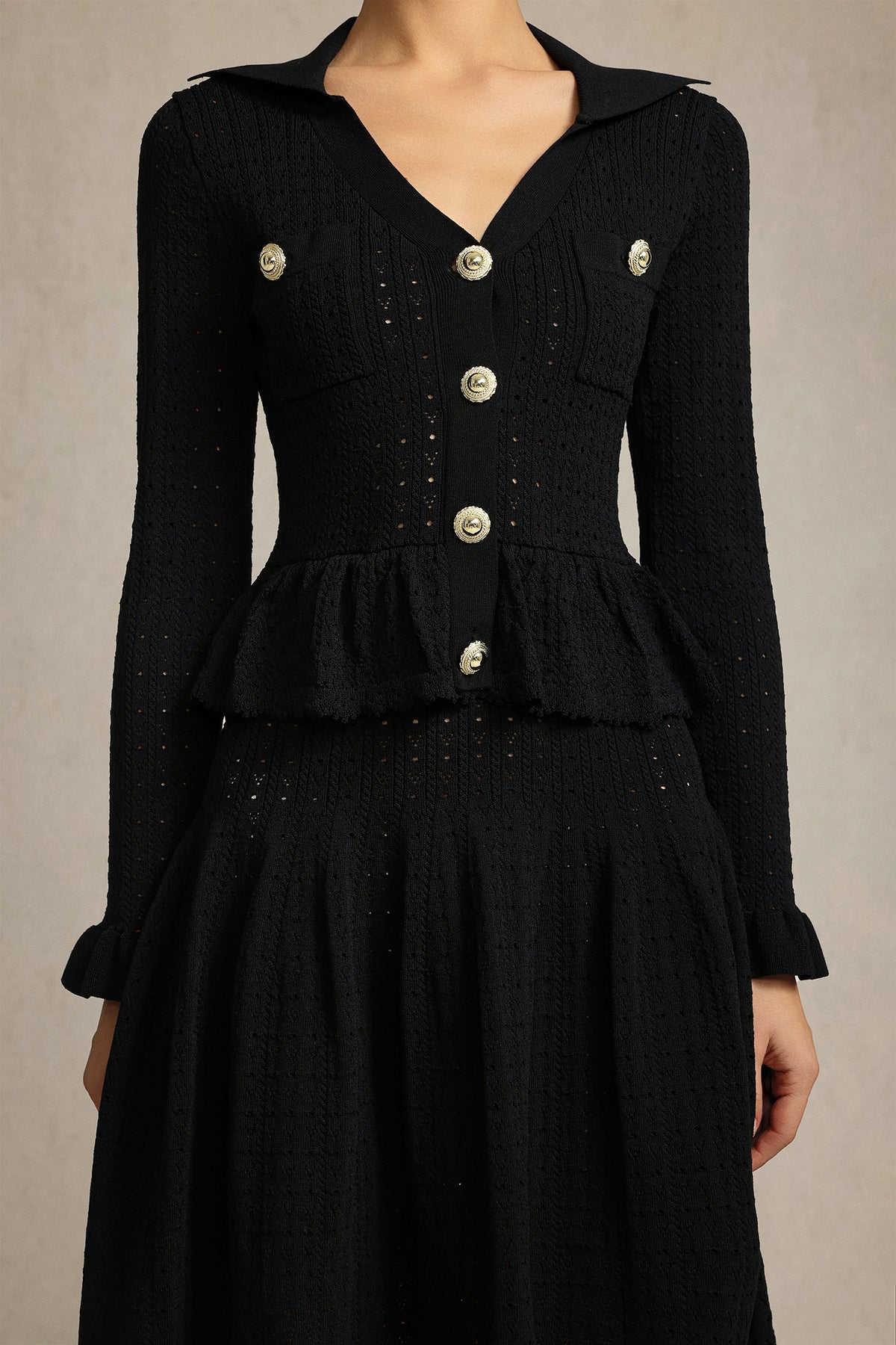 Leaf-edge paneled V-neck knitted mini dress in black