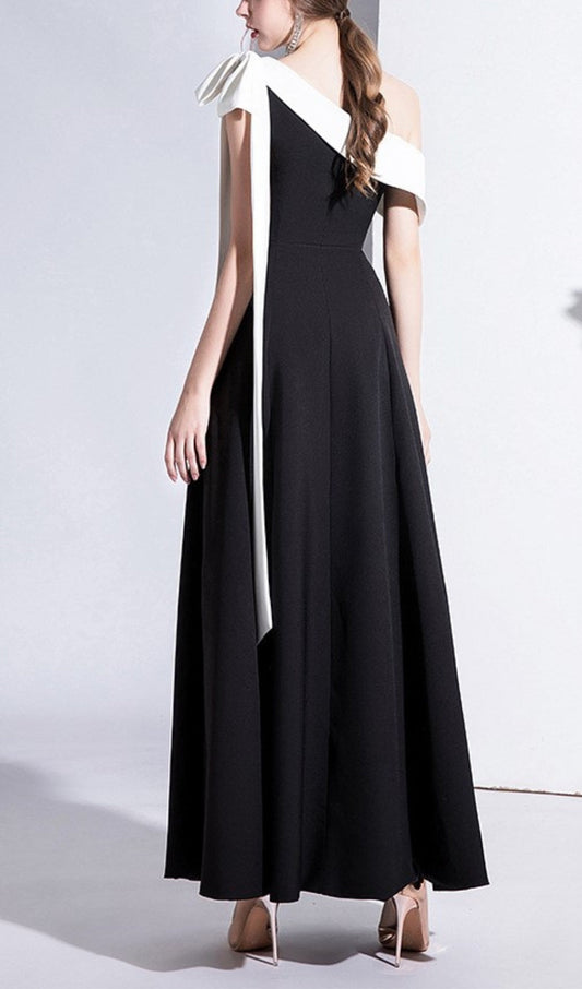 PAGGED BOW MIDI DRESS IN BLACK
