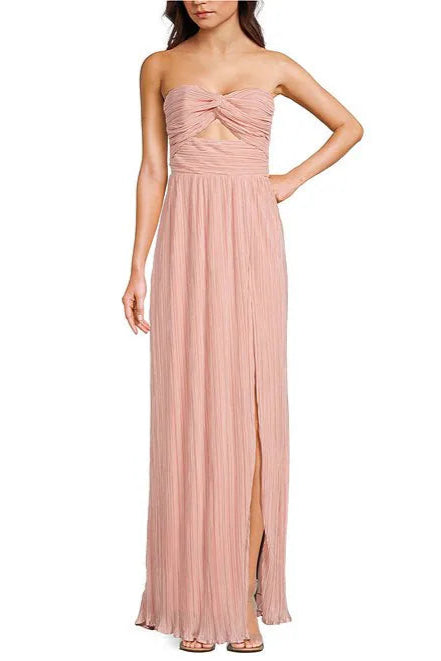 Strapless pleated maxi dress in pink with a flowy design and front cutout, featuring a zipper and elastic back.