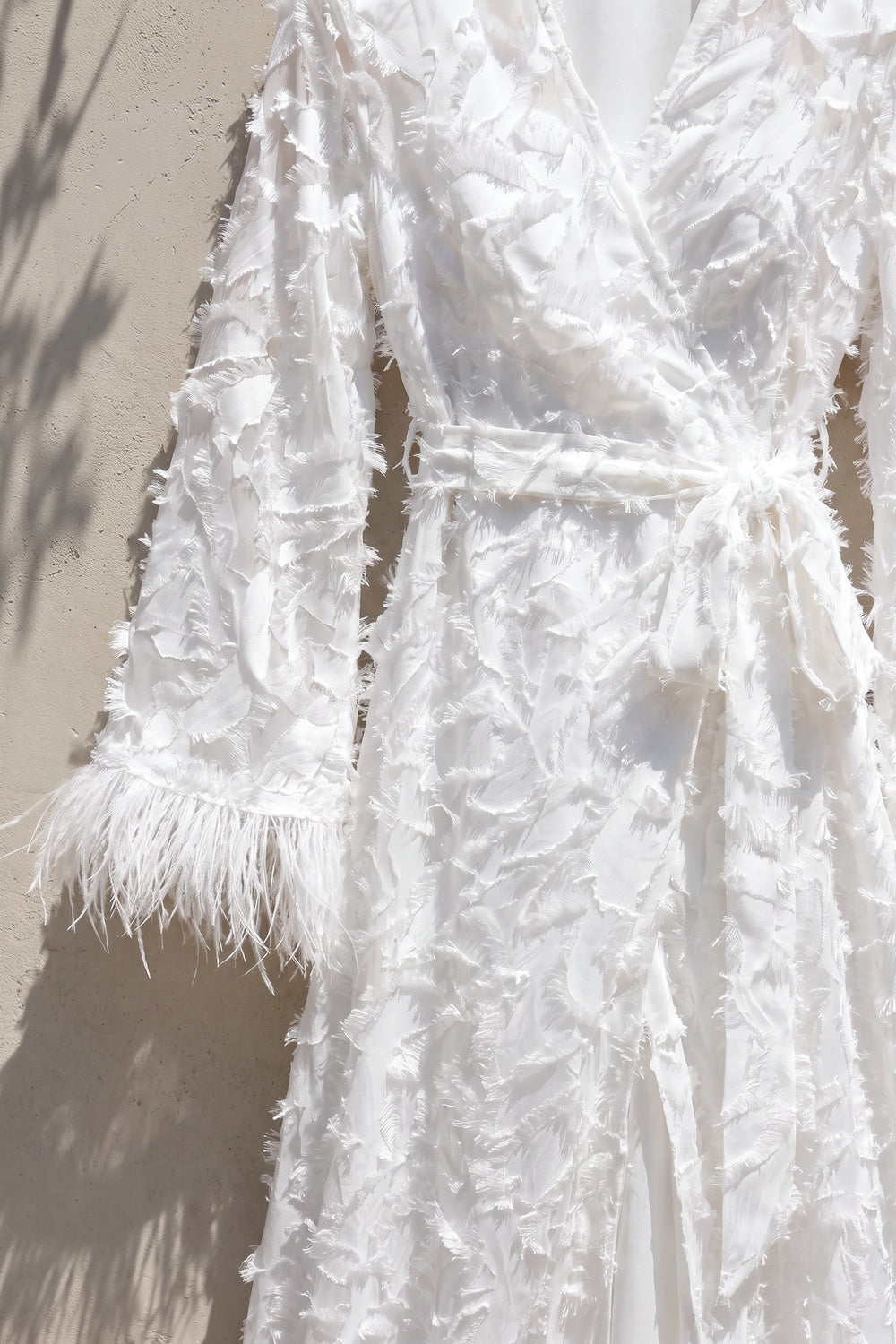 White Textured Eyelash Fabric A-Line Wrap Maxi Dress with Feather Trim white textured eyelash/shredded-ribbon fabric wrap maxi dress - product view 6