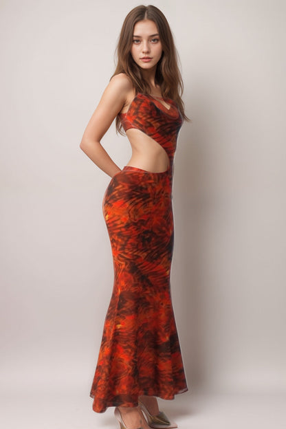 Woman wearing a red and black patterned dress on a plain background