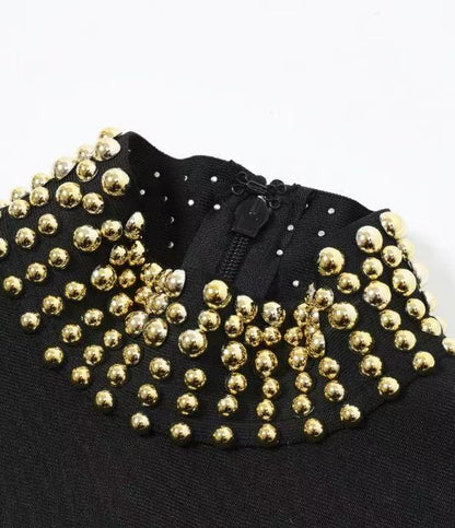 Black Heavy Bandage Knit Maxi Dress with Fringe Hem and Gold Embellishments