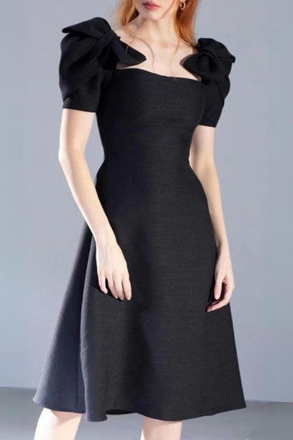 PATCHWORK BOW-EMBELLISHED MIDI DRESS IN BLACK