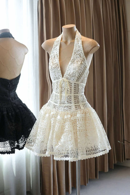 White lace dress on a mannequin against a curtain backdrop