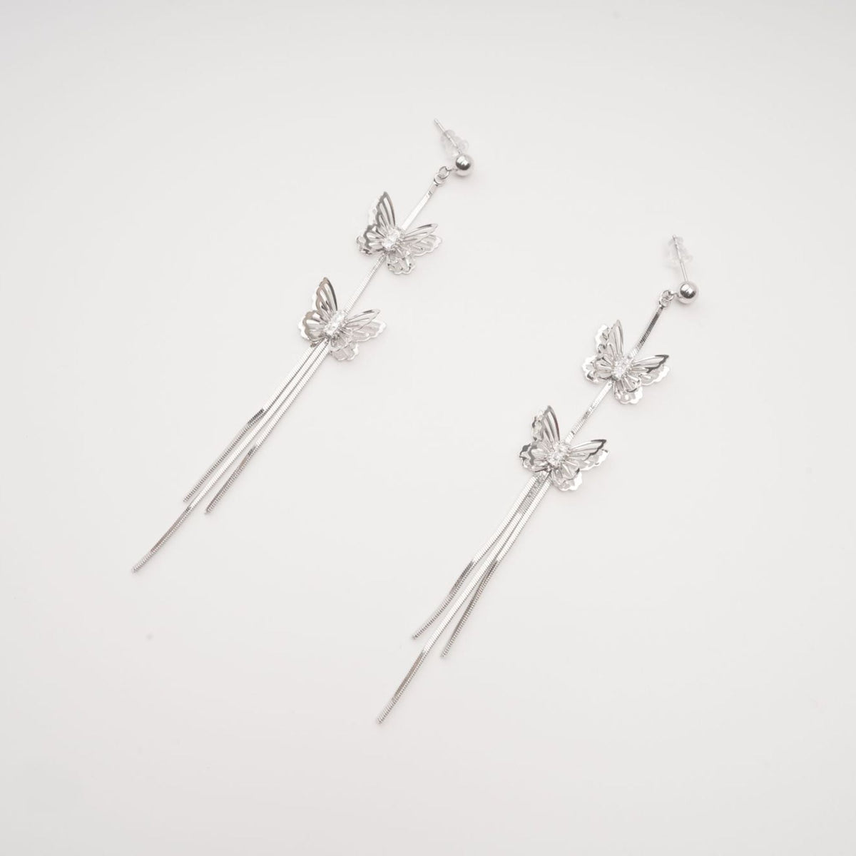 Bella silver butterfly drop earrings