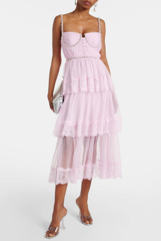 A pink midi dress with crystal embellishments and lace trim, sleeveless with a straight neckline.