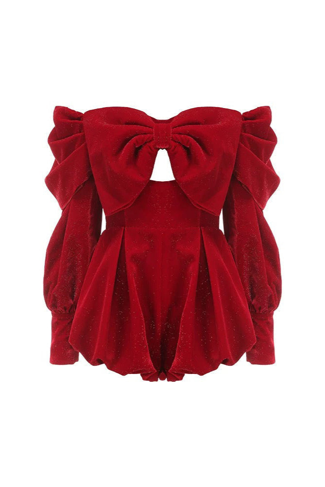 Red velvet top with a large bow on a white background