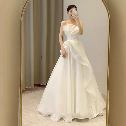 Lynn's white strapless minimalist wedding dress with a slimming effect Maxi Dress