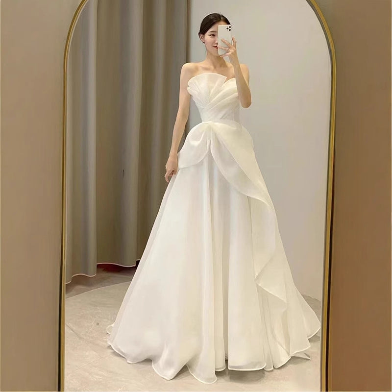 Lynn's white strapless minimalist wedding dress with a slimming effect Maxi Dress