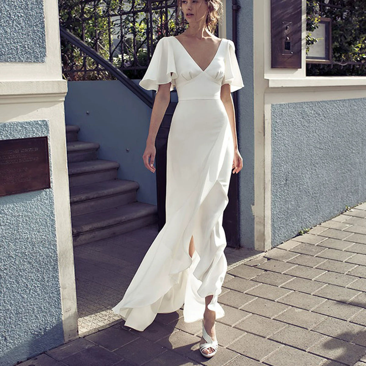 White irregular V-neck backless flared sleeves satin dress