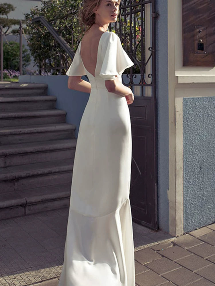 White irregular V-neck, backless long skirt, flared sleeves, elegant dress skirt, waist slimming, satin dress
