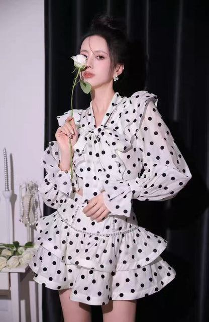 Black-white polka dot ruffled long-sleeved top with puffy skirt