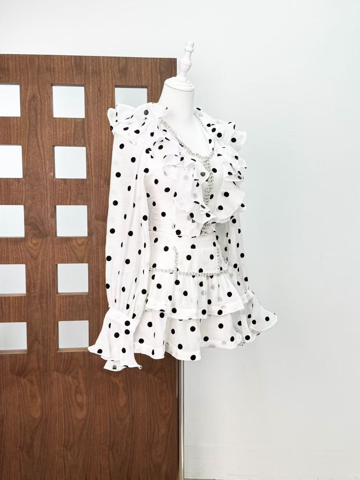 Black-white polka dot ruffled long-sleeved top with puffy skirt