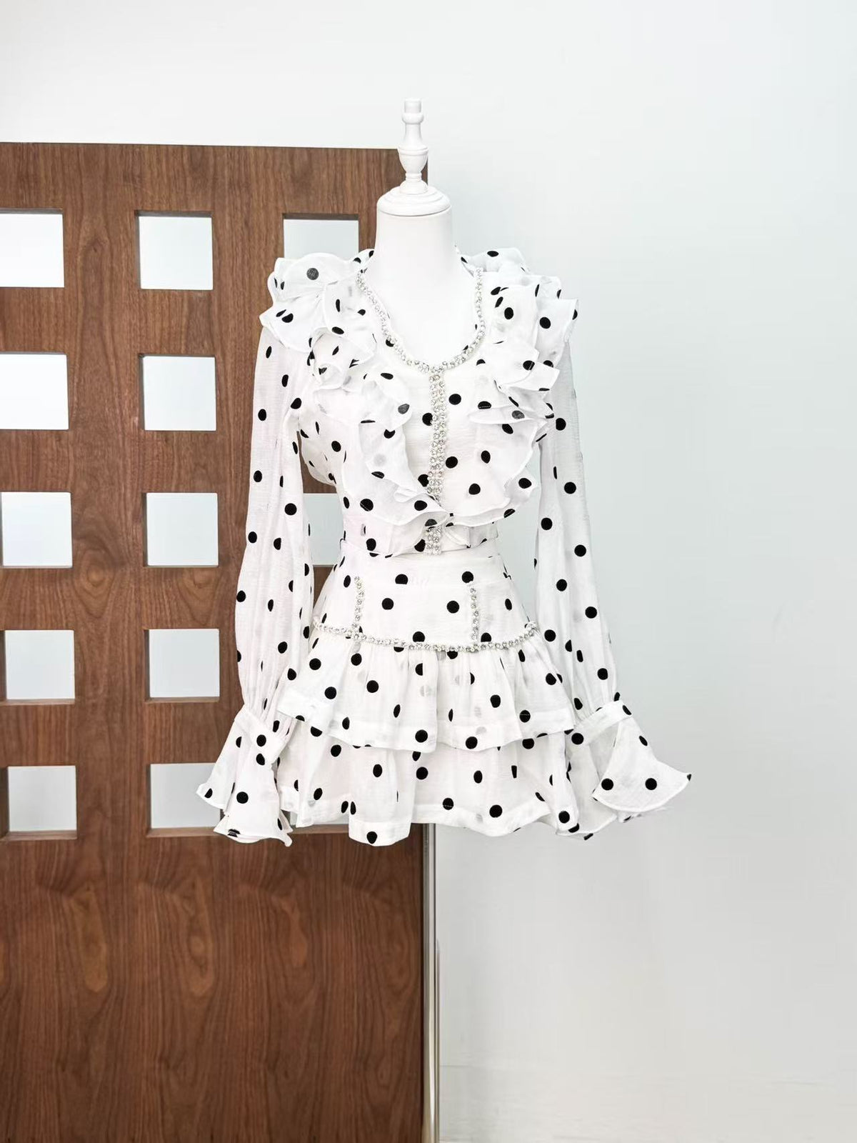 Black-white polka dot ruffled long-sleeved top with puffy skirt