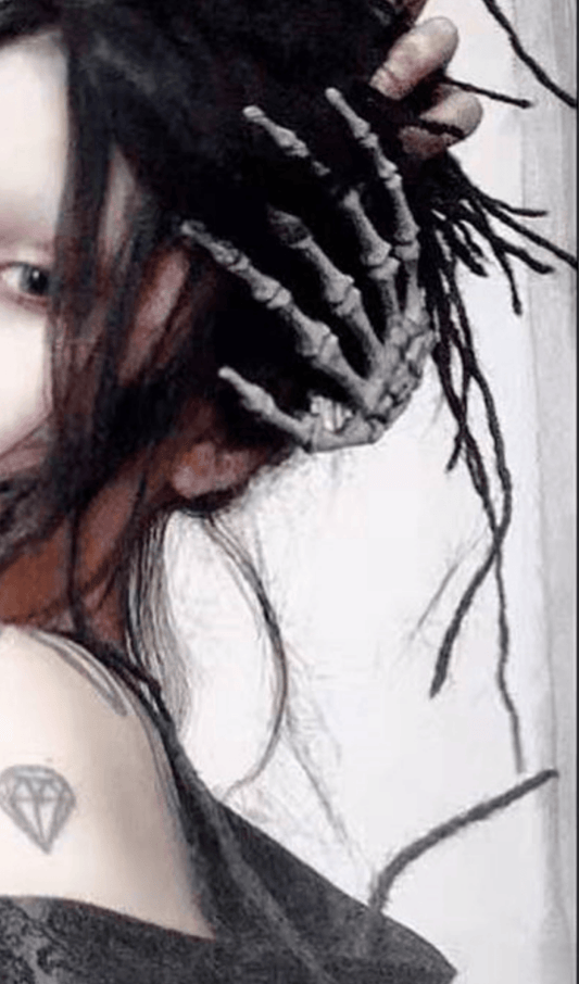 Skull hand bone hair clip