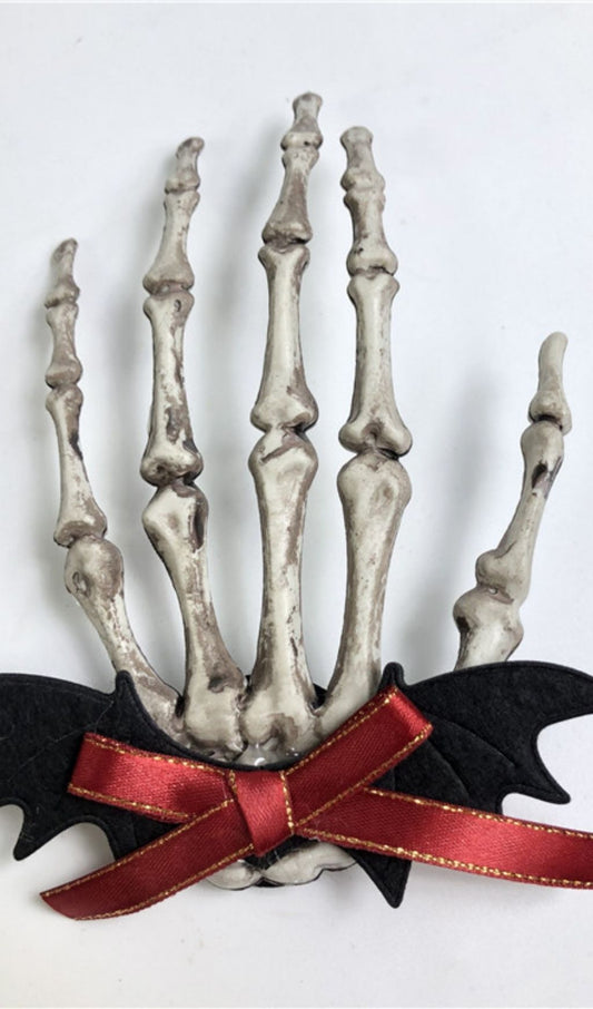 Skull hand bone hair clip