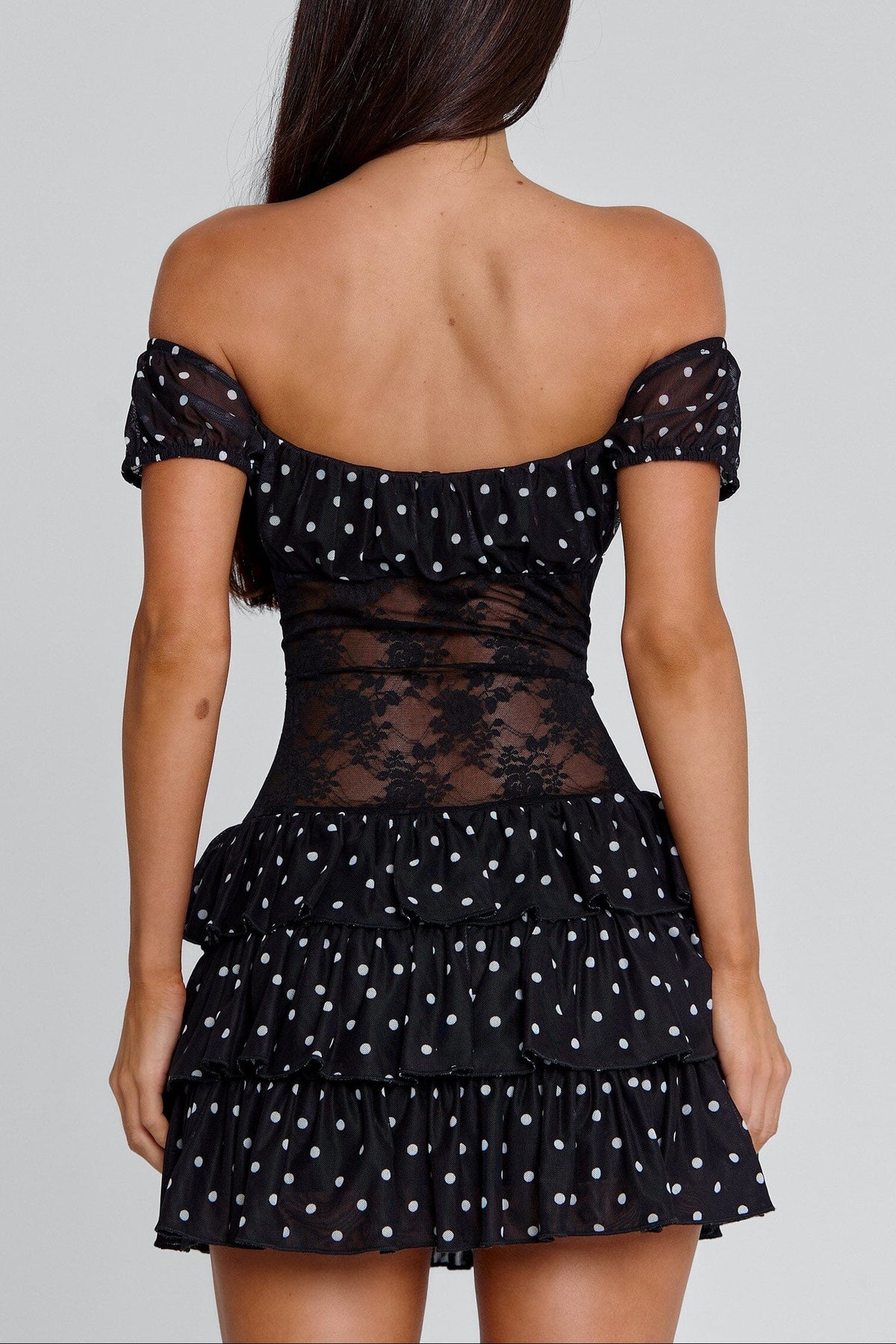 hedda Lace-trimmed polka dot strapless mini dress in black
