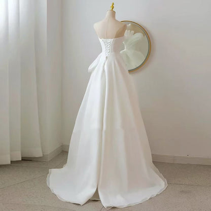 Lynn's white strapless minimalist wedding dress with a slimming effect Maxi Dress