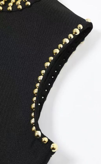 Black Heavy Bandage Knit Maxi Dress with Fringe Hem and Gold Embellishments