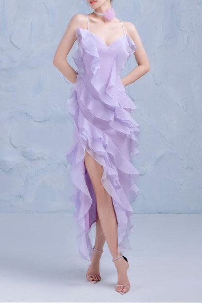 A woman wearing a lavender asymmetric ruffle layer organza mini dress with a sweetheart neckline.